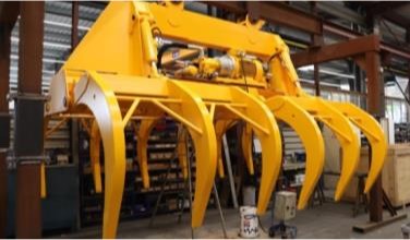 Grappins hydrauliques jaunes pour la manutention de la canne à sucre